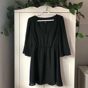Little black dress with bell sleeves